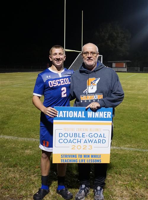 Coach Matthews and Devin Daughtry